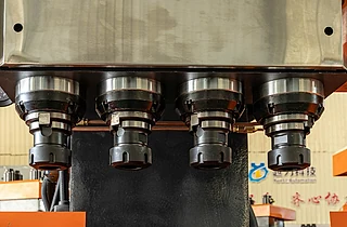Four synchronized drilling and tapping spindles